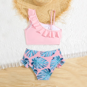 Pink one-shoulder girls' two-piece swimsuit with ruffle trim and tropical leaf print