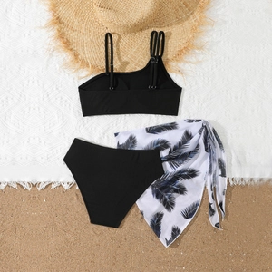 Three-piece girls bikini set with black ribbed top and palm leaf print beach sarong
