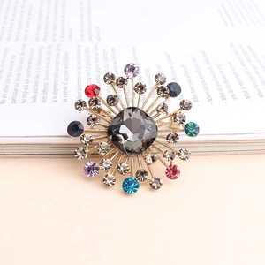 Vintage style colorful rhinestone brooch with a large grey gemstone in sunflower design