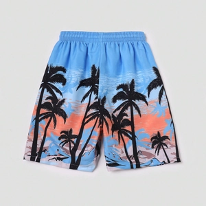 Short de plage enfant bleu ciel avec imprimé cocotiers et taille élastique rapide