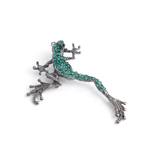 Charming gunmetal frog brooch set with vibrant green rhinestones and black crystal eyes