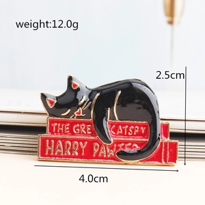 Cute black cat enamel pin lying on red books, minimalist cartoon animal brooch accessory