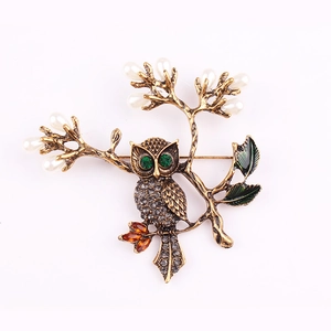 Broche hibou vintage avec diamants gris, perles blanches et feuilles en émail vert