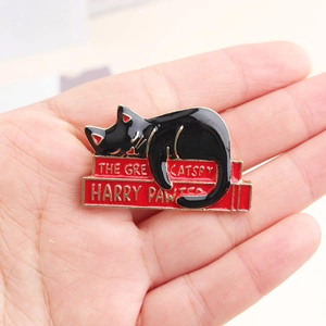 Creative black cat on books enamel pin featuring The Great Catspy and Harry Pawter