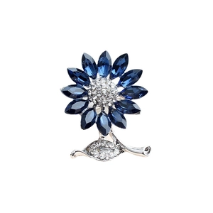 Elegant silver sunflower brooch with blue crystal petals and sparkling leaf accent