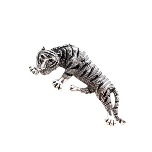 Silver alloy tiger brooch with black enamel stripes and detailed metallic grain texture