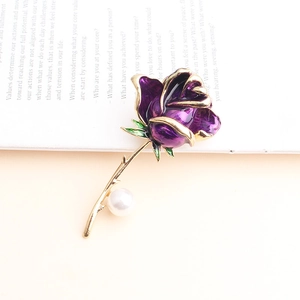 Elegant purple enamel rose brooch with gold stem and pearl accent on vintage background