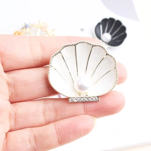 Fashion vintage shell brooch with white enamel, large center pearl and crystal details