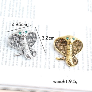 Fashionable crystal cobra snake brooches in silver and gold alloy finish
