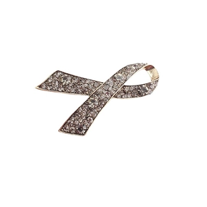 Elegant ribbon shaped brooch with grey rhinestones on gold plated metal base