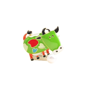 Cute green enamel cow brooch with colorful hearts and a white pearl accent