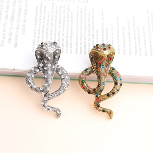 Broche cobra détaillée en argent avec zircons blancs et or antique avec pierres colorées
