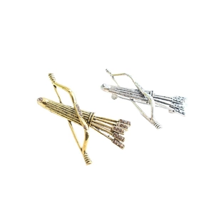 Broches chic en forme d'arc et flèche en alliage doré et argenté avec strass brillants