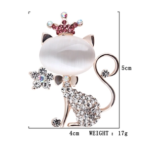 Cat brooch with white opal head and sparkling crystal body in gold finish, size 5x4cm