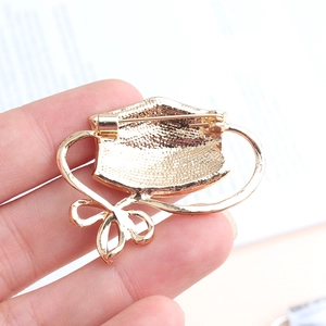 Detailed back view of cute animal pin showing secure metal safety clasp mechanism