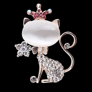 Charming rose gold cat brooch with opal stone, pink crown and white crystals on black background