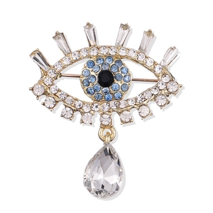 Broche œil de cristal avec pendentif goutte dorée pour costumes et manteaux