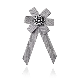 Elegant grey striped ribbon bow brooch with snowflake rhinestone and central black gemstone