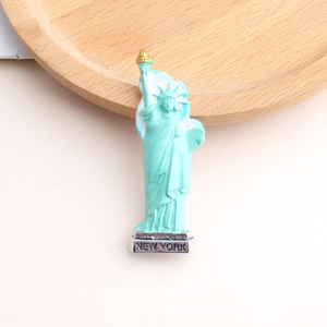 Detailed macro view of the Statue of Liberty brooch with New York base text