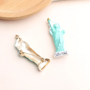Mint green Statue of Liberty enamel brooch with gold metal back and New York text