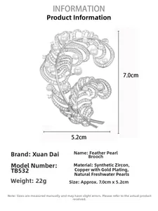 Detail view of pearl feather brooch with dimensions 7.0cm by 5.2cm on white background