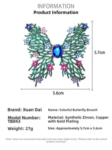 Detail showing green cubic zirconia butterfly brooch with gold plating and dimensions