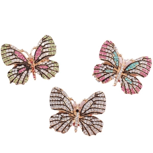 Lot de trois broches papillon avec strass colorés sur une base en alliage doré