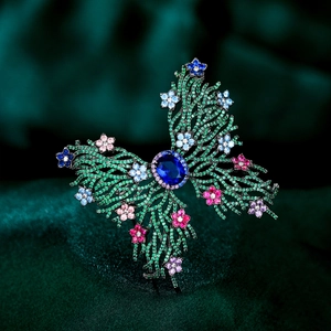 Detailed macro view of luxurious butterfly brooch with colorful micro-pave zircons