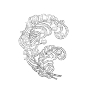Elegant silver feather brooch featuring freshwater pearls and micro-pave cubic zirconia stones