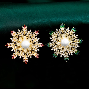 Macro detail of luxury snowflake brooch with sparkling zircons and a central pearl