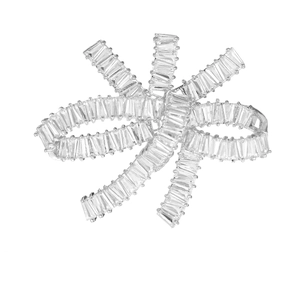 Close-up of sparkling bow brooch featuring baguette-cut zircon in silver finish