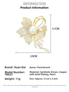 Detail view of flower brooch with cubic zirconia, pearl tassel, and size dimensions