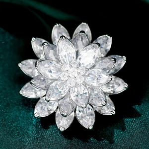 Close-up of sparkling three-layer snow lotus brooch with marquise-cut zircon stones