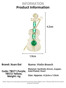 Detail view of violin brooch with green zircon inlay and a small white shell pearl