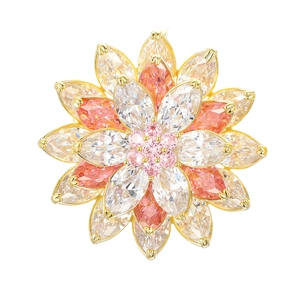 Detailed macro view of triple-layered snow lotus brooch with colorful marquise zircons