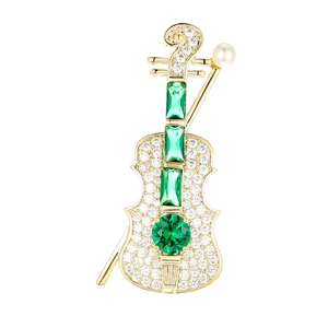 Exquisite gold violin brooch with green emerald gems, micro-pave stones and pearl accent