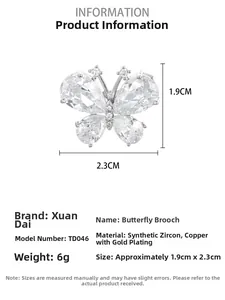 Detail showing butterfly brooch dimensions of 1.9cm x 2.3cm with zircon inlay