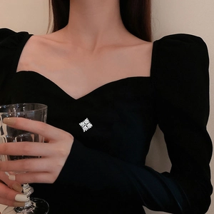 Elegant black long-sleeved dress with heart square neck and silver crystal brooch accent