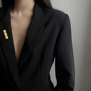 Elegant triple oval yellow zircon brooch with micro-pave crystals on a black suit lapel