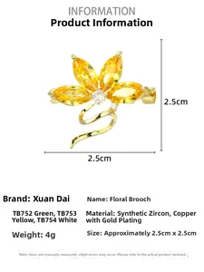 Macro shot of 2.5cm yellow orchid brooch with synthetic cubic zirconia and gold plating