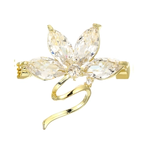 Detail of elegant orchid brooch with marquise-cut clear stones and golden S-line design