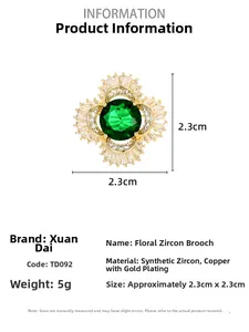 Detail of flower brooch with green cubic zirconia and dimensions 2.3cm by 2.3cm