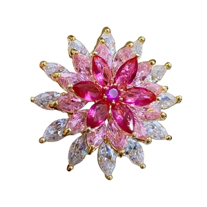 Luxury rotating snowflake brooch with pink and clear marquise cut crystals in gold plating