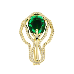 Broche élégante dorée avec pierre émeraude en forme de poire et oxydes de zirconium