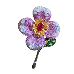 Luxury flower brooch with pink zircons, red gemstone center and green crystal leaf design