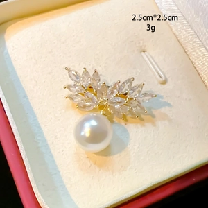 Detail of leaf brooch with marquise cubic zirconia, white pearl and size 2.5cm x 2.5cm