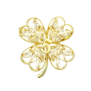 Golden four-leaf flower brooch with marquise-cut zircons and number five detail