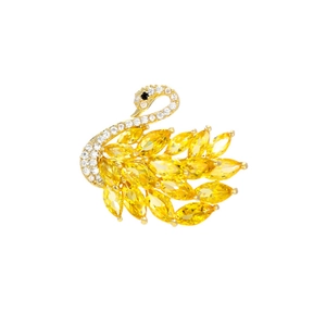 Elegant gold swan brooch with yellow marquise gems and sparkling white crystals