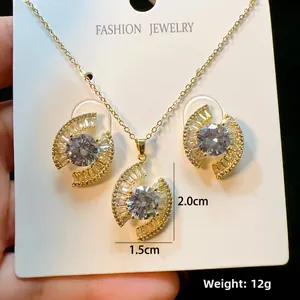 Elegant gold-plated geometric jewelry set including necklace and stud earrings with zircons