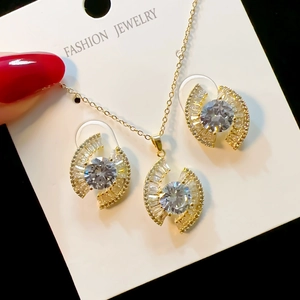 Detailed view of evil eye jewelry set featuring micro-pave crystals on gold finish